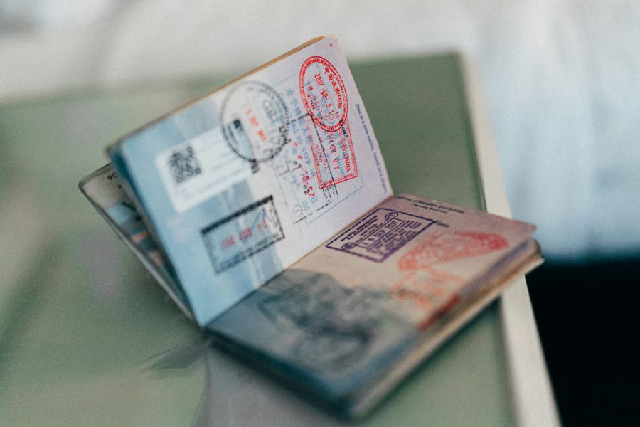 Open passport with international visa stamps